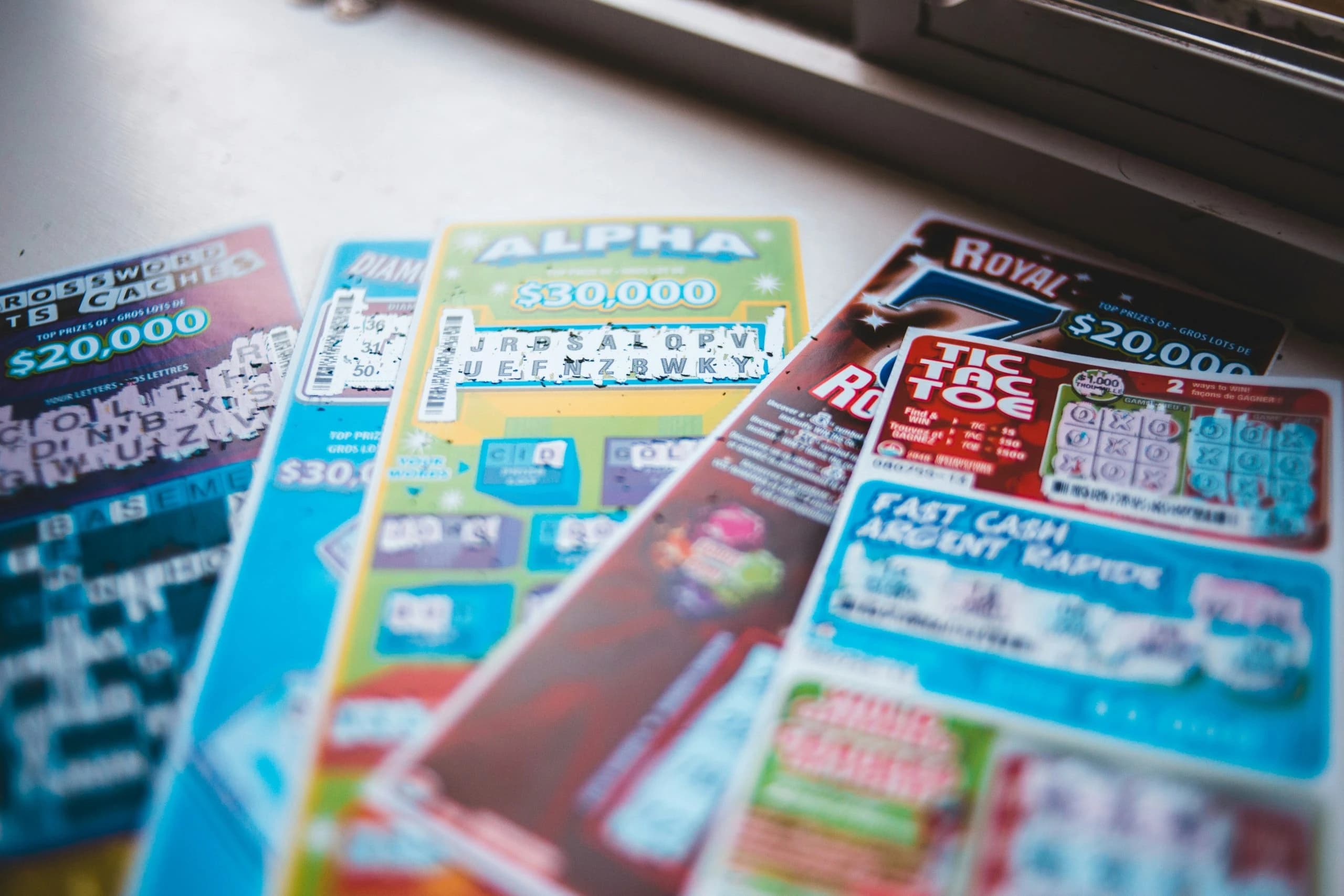 Gig economy courier delivering National Lottery scratchcards to a doorstep